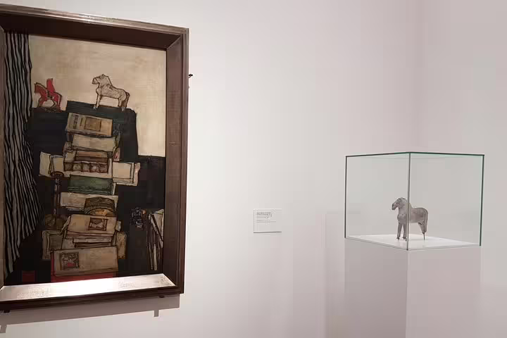 Exhibit at Leopold Museum featuring Egon Schiele's artwork and a horse sculpture, part of private themed tour.