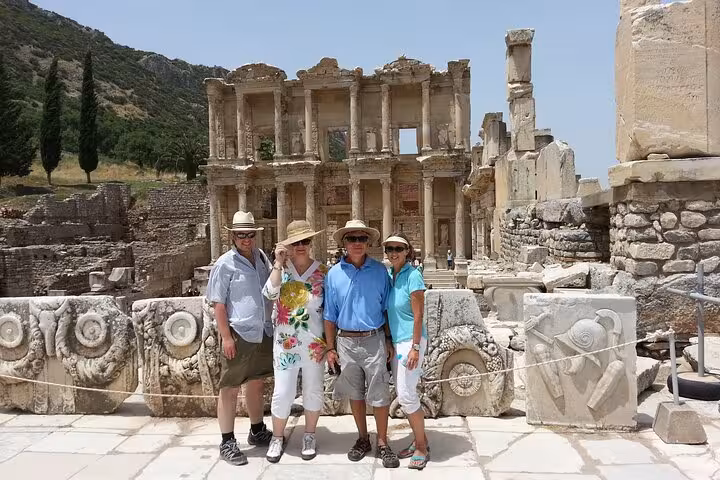 Travelers posing at the Library of Celsus on a private Ephesus tour from Kusadasi Port shore excursion