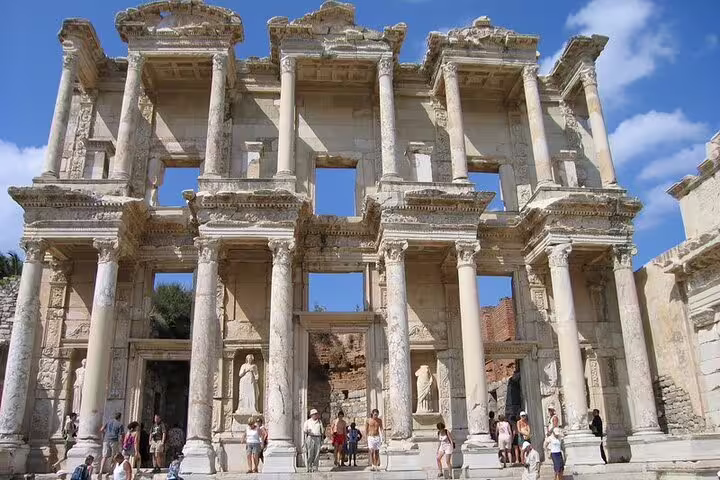 Library of Celsus facade in Ephesus with columns and visitors, must-see on 7-day guided Western Turkey tour