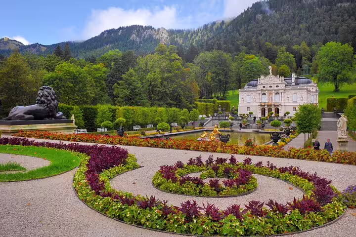Linderhof Palace gardens with fountains in the Bavarian Alps, highlight of Munich day trip tour