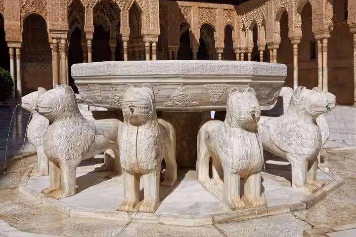Intricately carved Lion Fountain in Alhambra, Granada, showcasing Moorish artistry on the Galicia Portugal Andalucia itinerary.