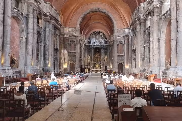 Interior view of Lisbon's Igreja de São Domingos, showcasing its historic architecture and atmospheric setting.