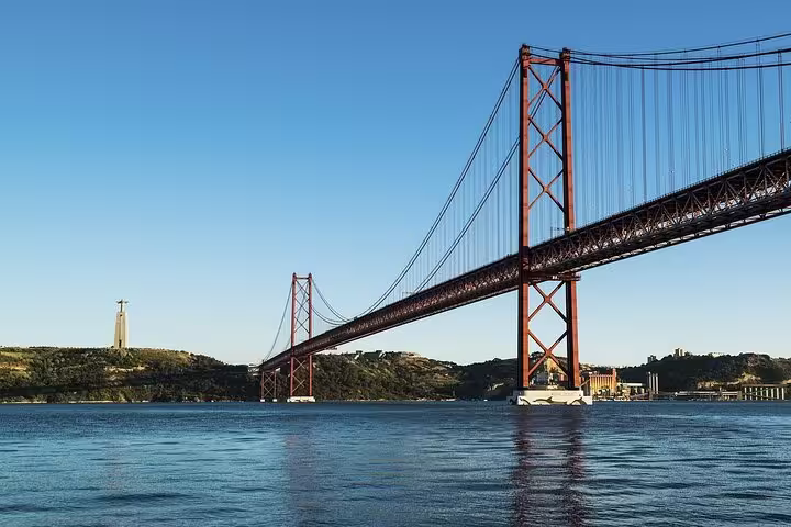 Discover Lisbon's 25 de Abril Bridge on a private tour, offering panoramic views of the Tagus River and Cristo Rei statue.