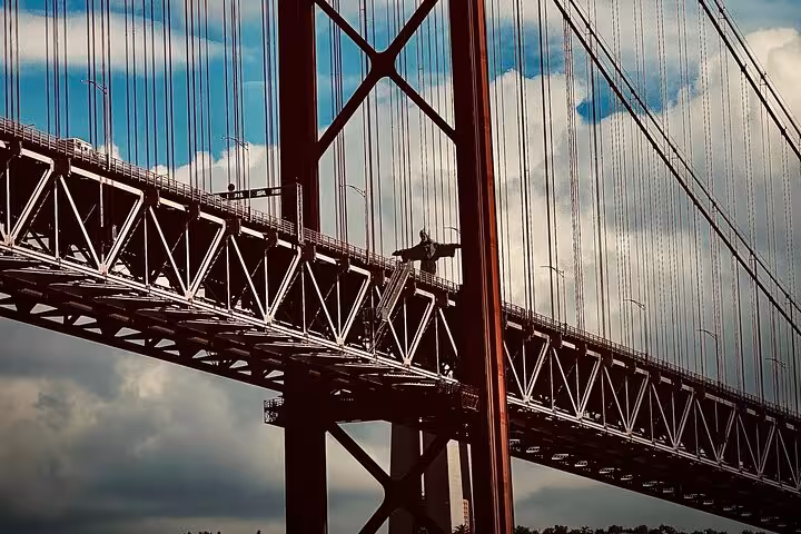 25 de Abril Bridge view on Lisbon tuk-tuk tour, iconic suspension bridge over the Tagus River