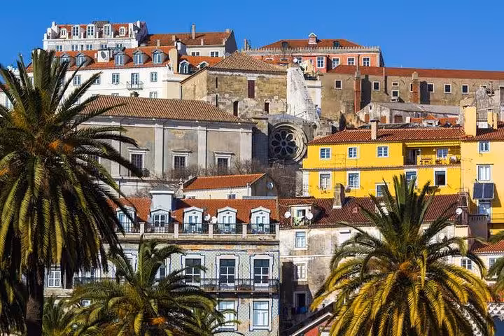 Colorful historic buildings in Lisbon's Alfama district, showcasing vibrant architecture on the private tour.