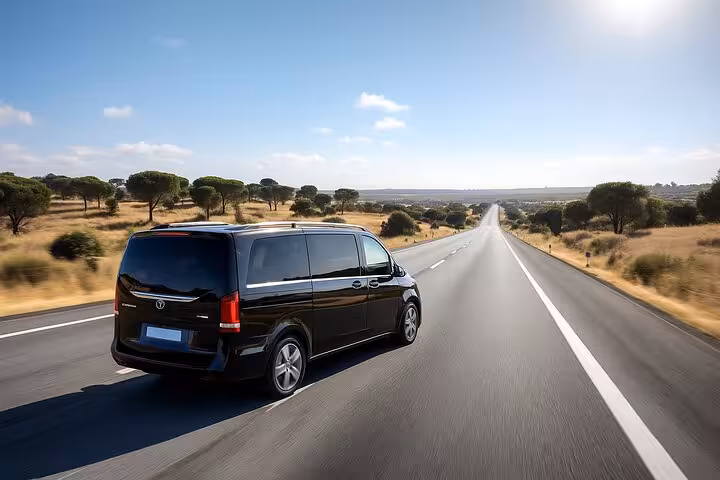 Private Mercedes van on scenic Lisbon to Algarve route, highlighting comfort and luxury travel in Portugal.