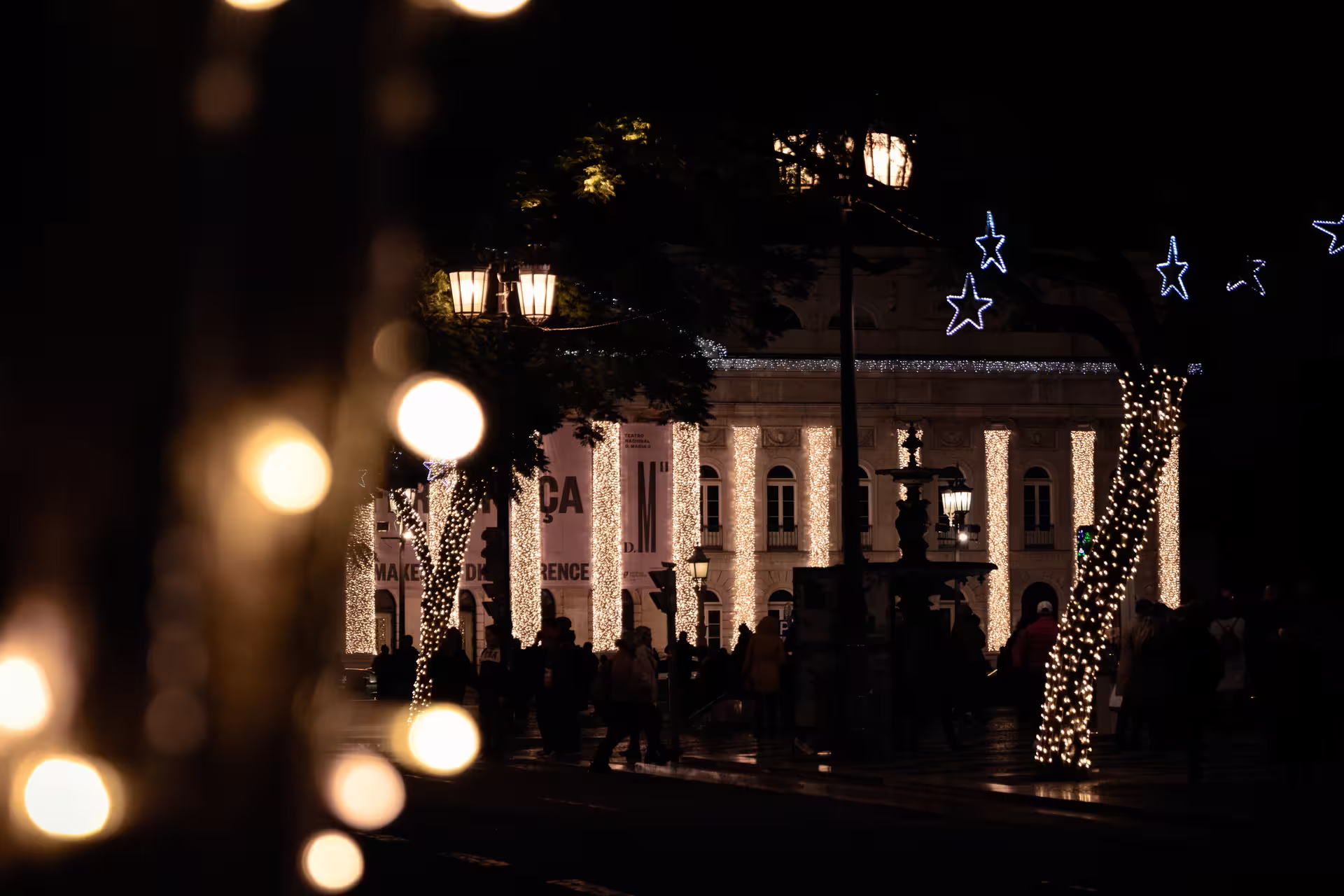 Lisbon's Christmas lights illuminate the night with festive charm on a private photo walk, capturing the city's holiday spirit.