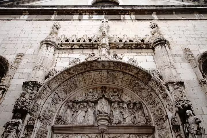 Intricate stone carvings on a historic Lisbon church facade, featured in the Highlights and Secrets of Lisbon Walking Tour.