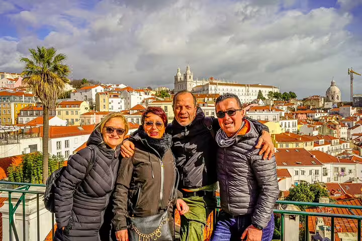 Group enjoying Lisbon city view, ideal for enhancing Lisbon airport shuttle service listings with vibrant, travel-friendly imagery.