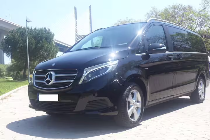 Luxurious black Mercedes van ready for private journey from Lisbon to Douro Valley, showcasing comfort and style.