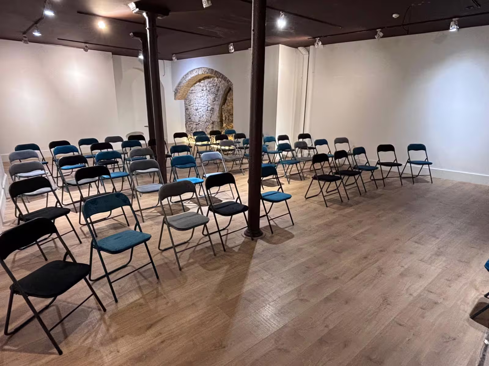 Intimate venue with rows of chairs set for an immersive live Fado session in Lisbon.