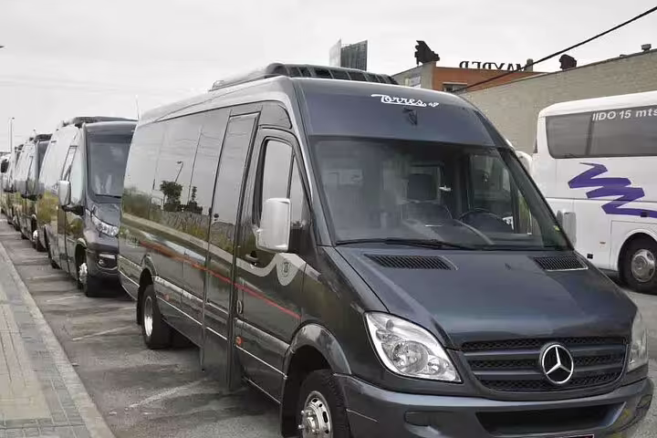 Comfortable tour buses ready for departure from Lisbon to the Sanctuary of Fatima and Roman city Conimbriga excursion.