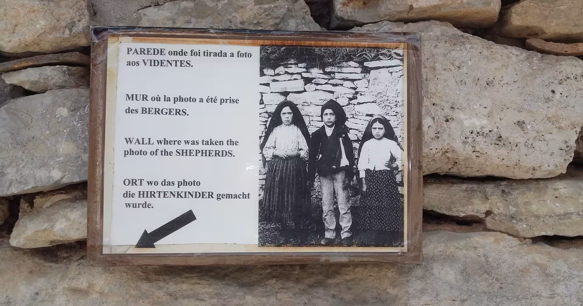 Historic sign marking the shepherds’ photo wall in Fátima, key stop on Lisbon to Fátima spiritual half-day tour