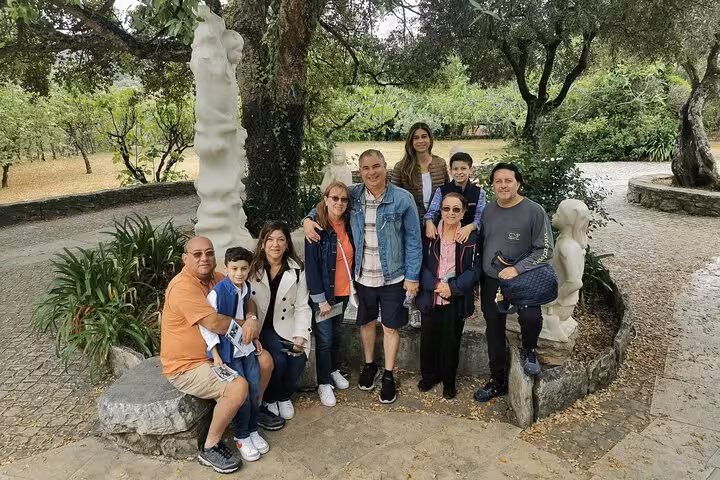 Tour group in shaded garden stop on Lisbon to Fatima and back day trip for WYD Lisbon 2023 Aug 5