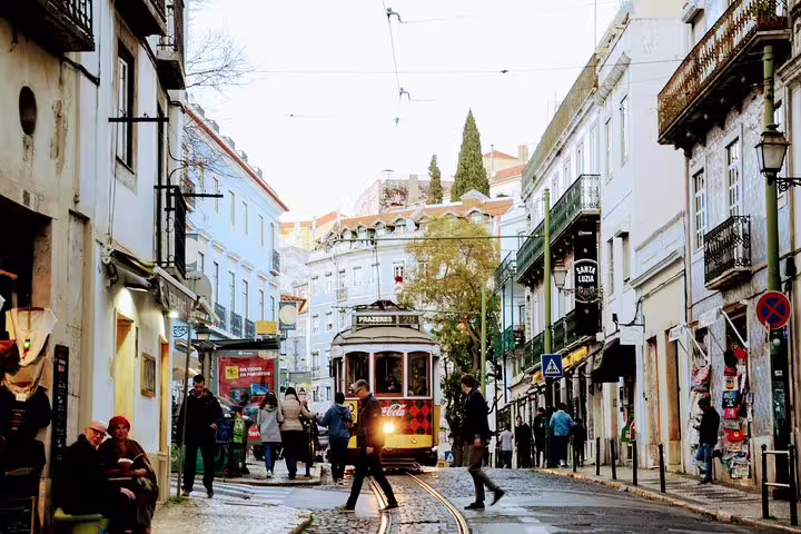 Historic tram navigating the charming, narrow streets of Lisbon, offering a glimpse into the city's rich cultural heritage.