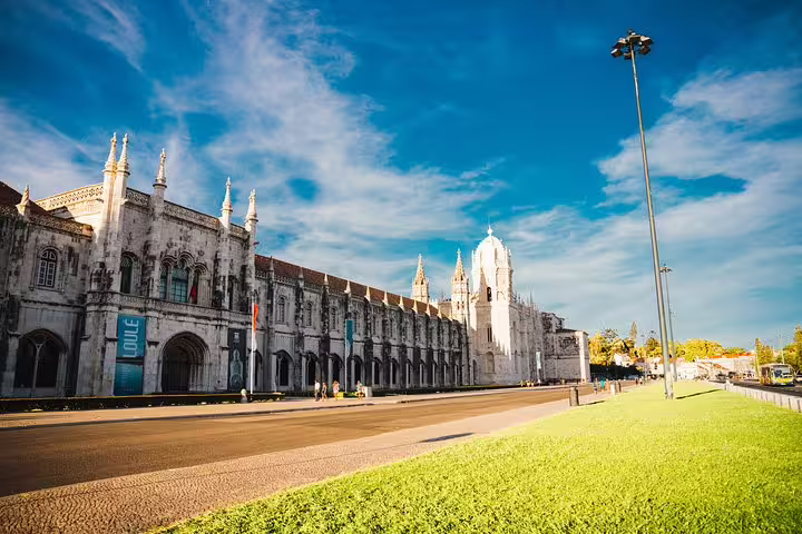 Explore Lisbon's historic Jerónimos Monastery on a private 4-hour tuk tuk tour with a local guide.