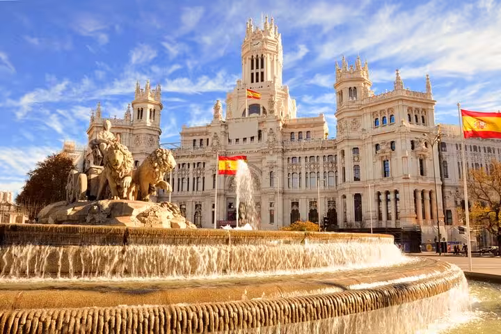 Scenic view of the majestic Cibeles Palace and Fountain in Madrid, a highlight of the Lisbon to Madrid Mercedes transfer tour.