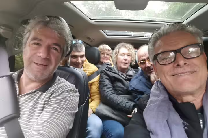 Group enjoying a private transfer from Lisbon to Madrid with scenic stops in Evora and Toledo, showcasing a comfortable journey.