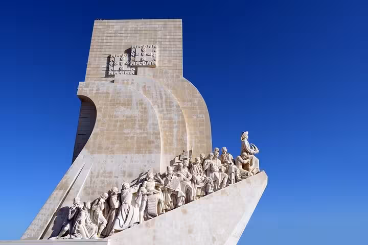 Discover Lisbon's iconic Padrão dos Descobrimentos monument under clear blue skies on a full-day private tour.