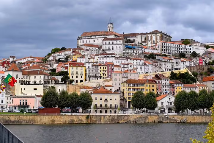 Scenic view of colorful hillside buildings in Coimbra, Portugal, along the Lisbon to Porto private journey route.