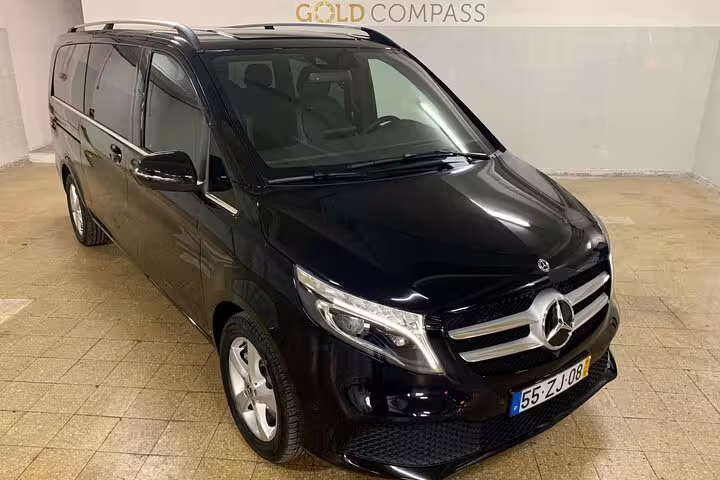 Luxurious black Mercedes van ready for private journey from Lisbon to Porto, offering direct route or customized stops.