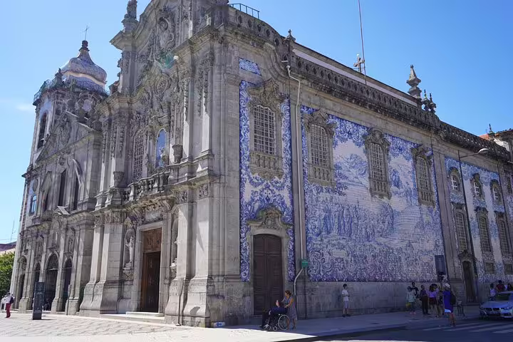 Historic church with intricate blue azulejos in Portugal, ideal stop on Lisbon to Porto transfer via Obidos, Nazare, Alcobaca.
