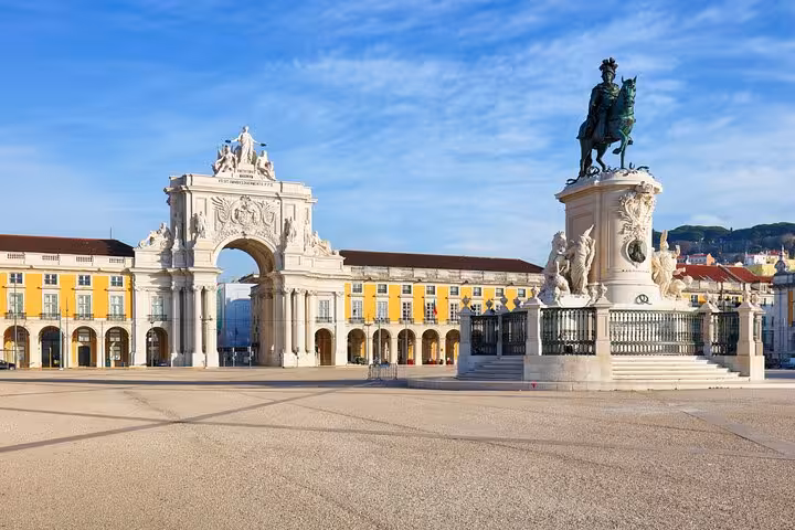 Explore Lisbon's iconic Praça do Comércio with its grand arch and equestrian statue on the Sintra and Cascais tour.