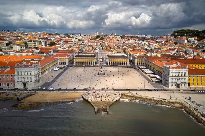 Aerial view of Lisbon's Praça do Comércio, showcasing its historic architecture and vibrant cityscape.