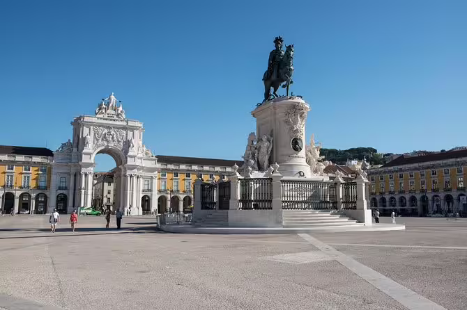 Explore Lisbon's iconic Praça do Comércio with its grand arch and equestrian statue on a guided small group day trip.