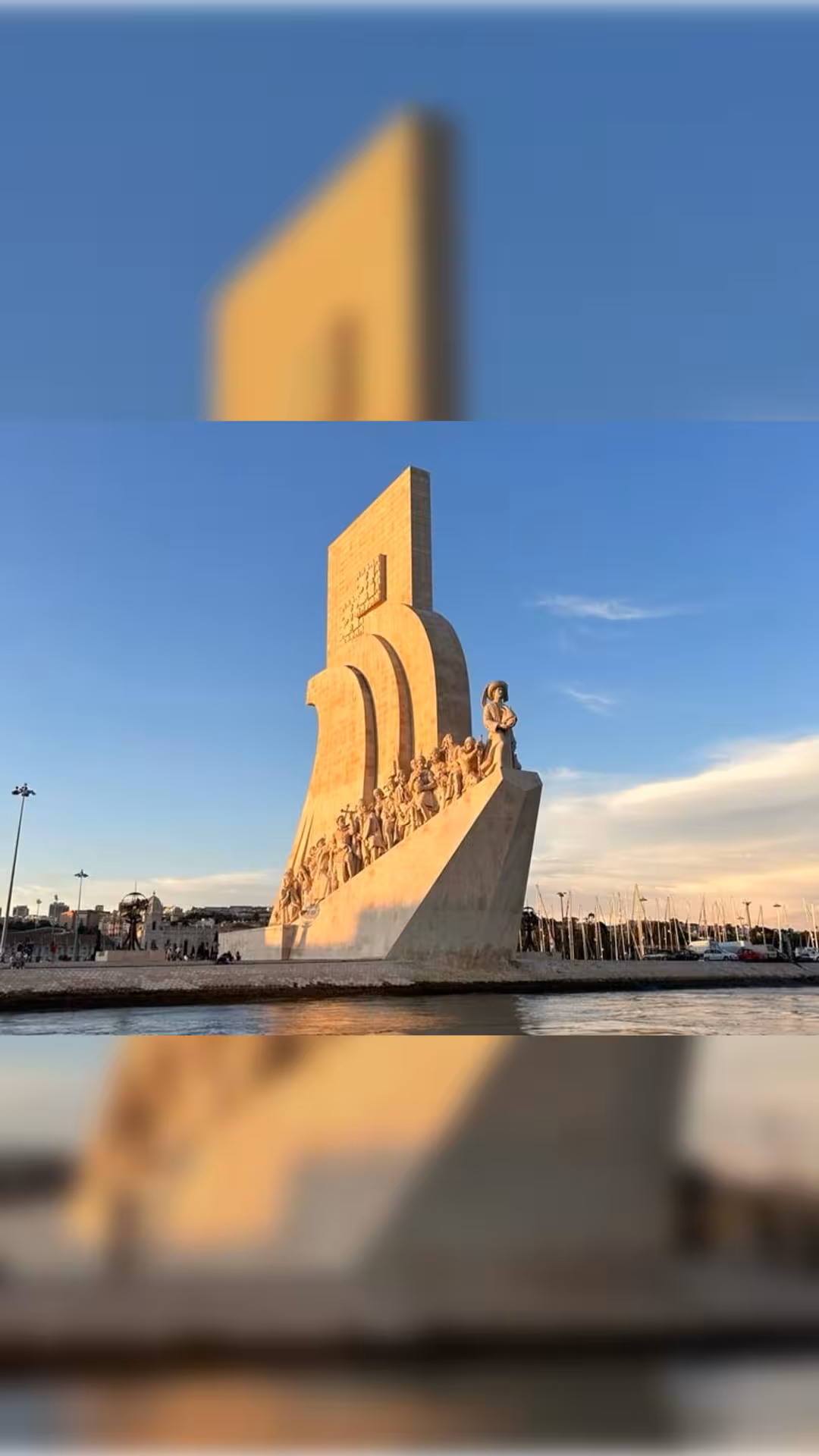 Padrão dos Descobrimentos monument seen from the Tagus River on a Lisbon private boat tour at golden hour
