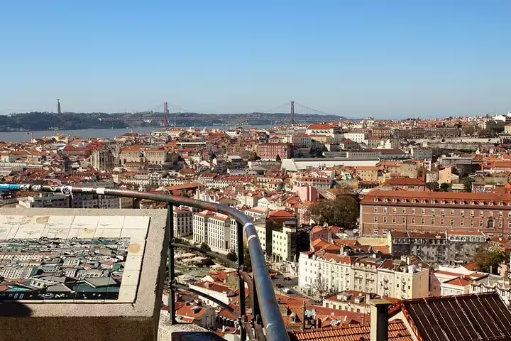 Panoramic view of Lisbon with iconic landmarks, perfect for a half-day private tour in a premium vehicle with custom stops.