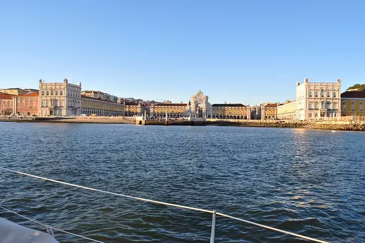 View of Praça do Comércio from a Lisbon private sailing cruise on the Tagus River, drink included