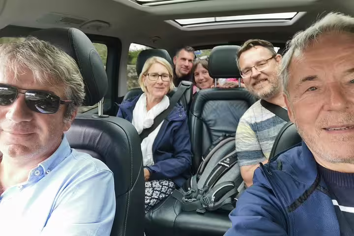 Group of tourists enjoying a comfortable private tour from Lisbon to Óbidos, Nazaré, Alcobaça, Batalha, and Fátima.