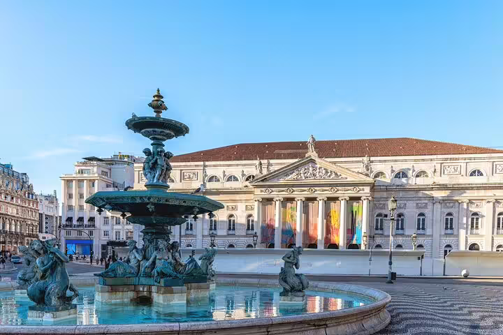Lisbon's Rossio Square with its iconic fountain and neoclassical architecture, perfect for exploring history and vibrant fado culture.