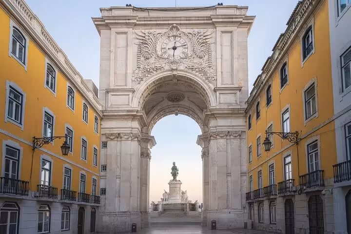 Explore Lisbon's iconic Rua Augusta Arch on a half-day private tour featuring stunning architecture and history.