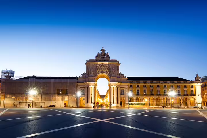 Majestic view of Lisbon's Rua Augusta Arch at twilight, highlighting the city's architectural beauty on a private Lisbon and Fatima tour.