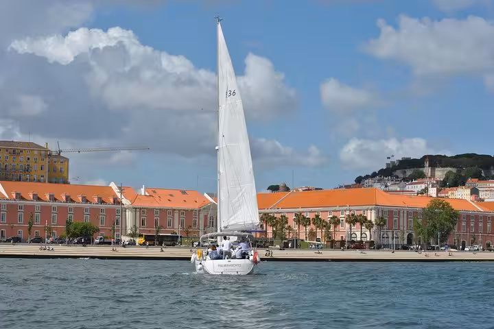 Small group sailboat cruising Lisbon old town on the Tagus River, 2-hour sailing tour with drink included
