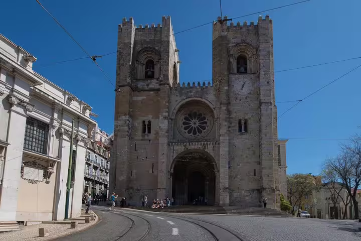 Explore the historic charm of Lisbon's Sé Cathedral on a full-day city tour, showcasing its medieval architecture.