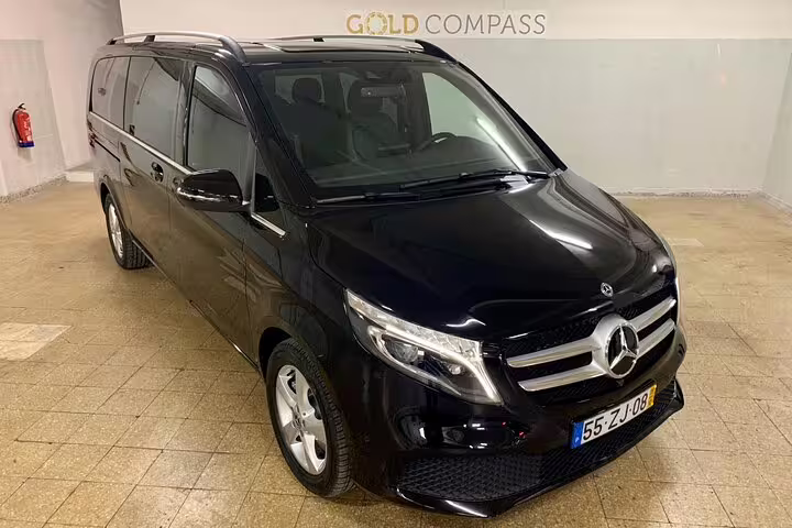 Luxurious black Mercedes van for private Lisbon to Seville journey, offering comfort and style on a direct travel route.