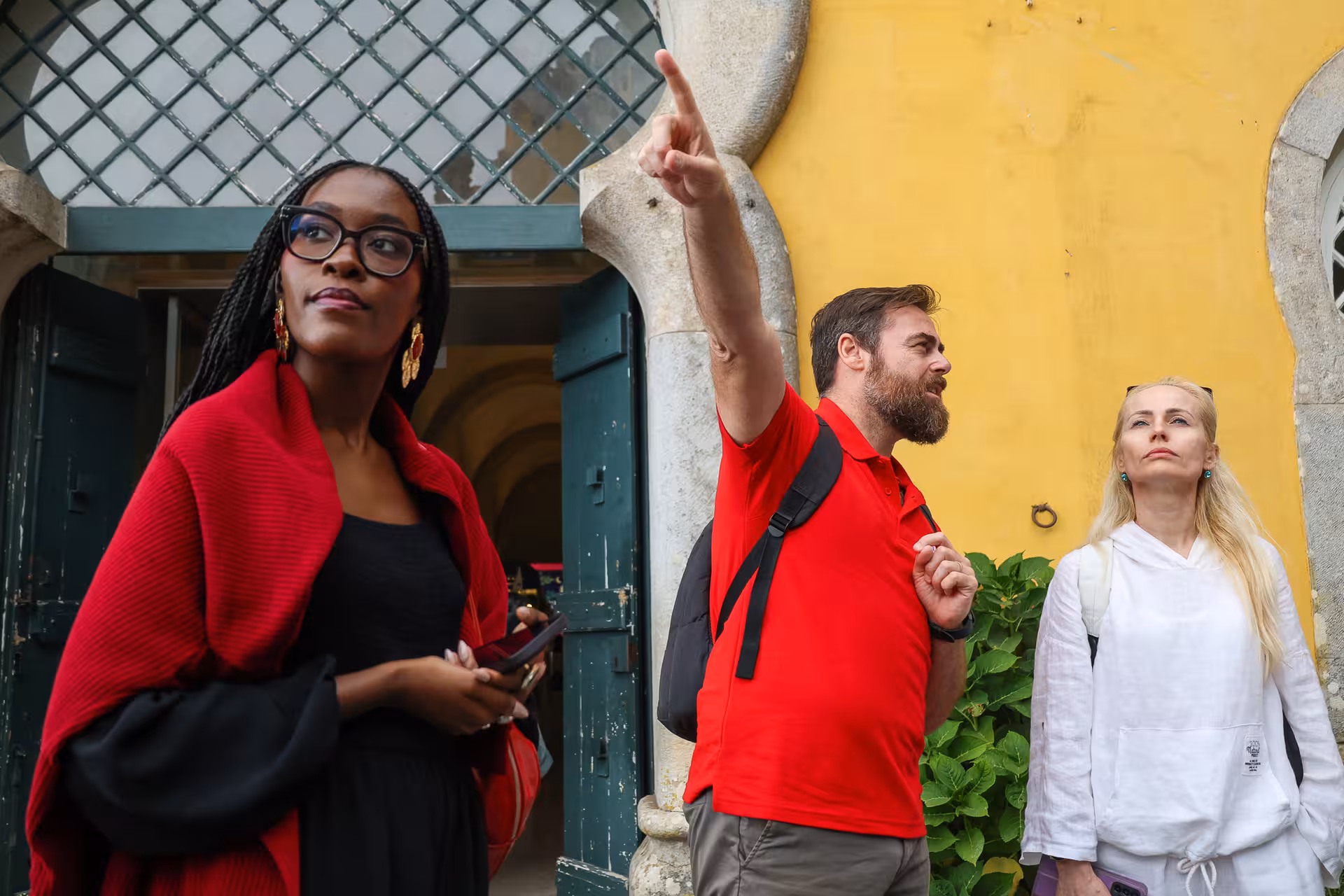 Tour participants exploring Sintra with a guide, part of the engaging Lisbon small-group excursion.