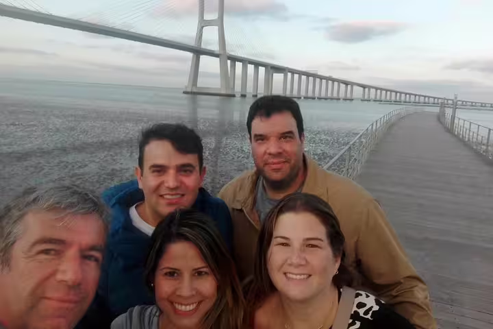 Group enjoying a scenic view of Vasco da Gama Bridge in Lisbon on a private tour, capturing the essence of a Portugal adventure.