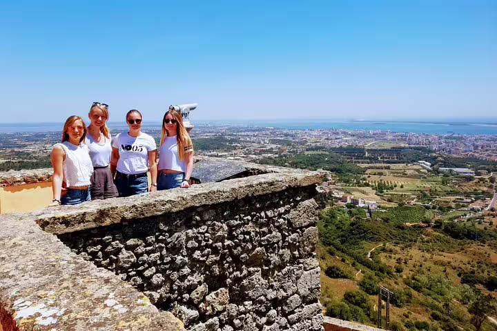 Group enjoying panoramic views on Lisbon's South Sights & Wine Private Tour, overlooking scenic landscapes and the Atlantic Ocean.