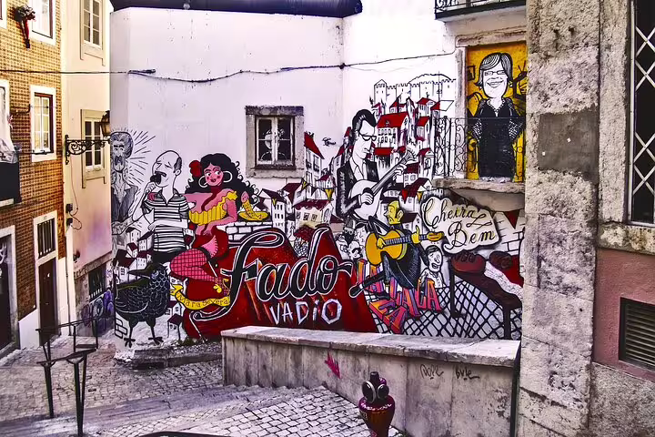 Vibrant street art in Lisbon's historic district captures the essence of Portuguese culture, perfect for a full-day private tour.