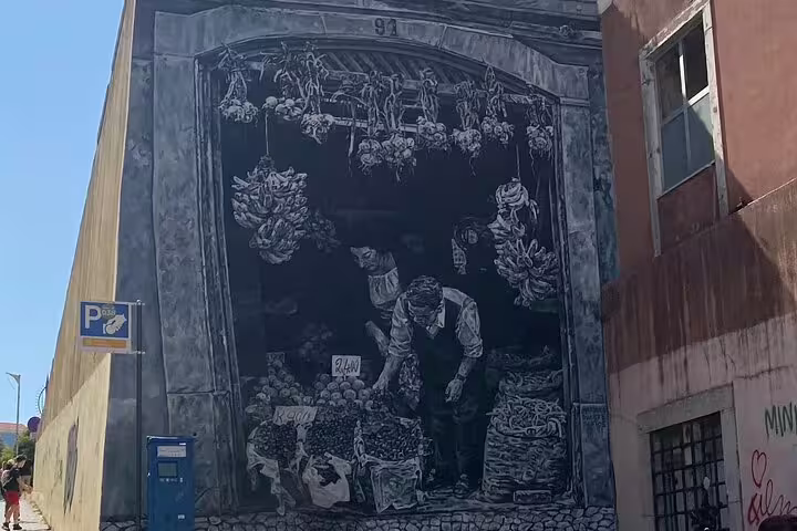 Striking Lisbon street art mural depicting a vintage market scene, capturing the essence of urban art culture.