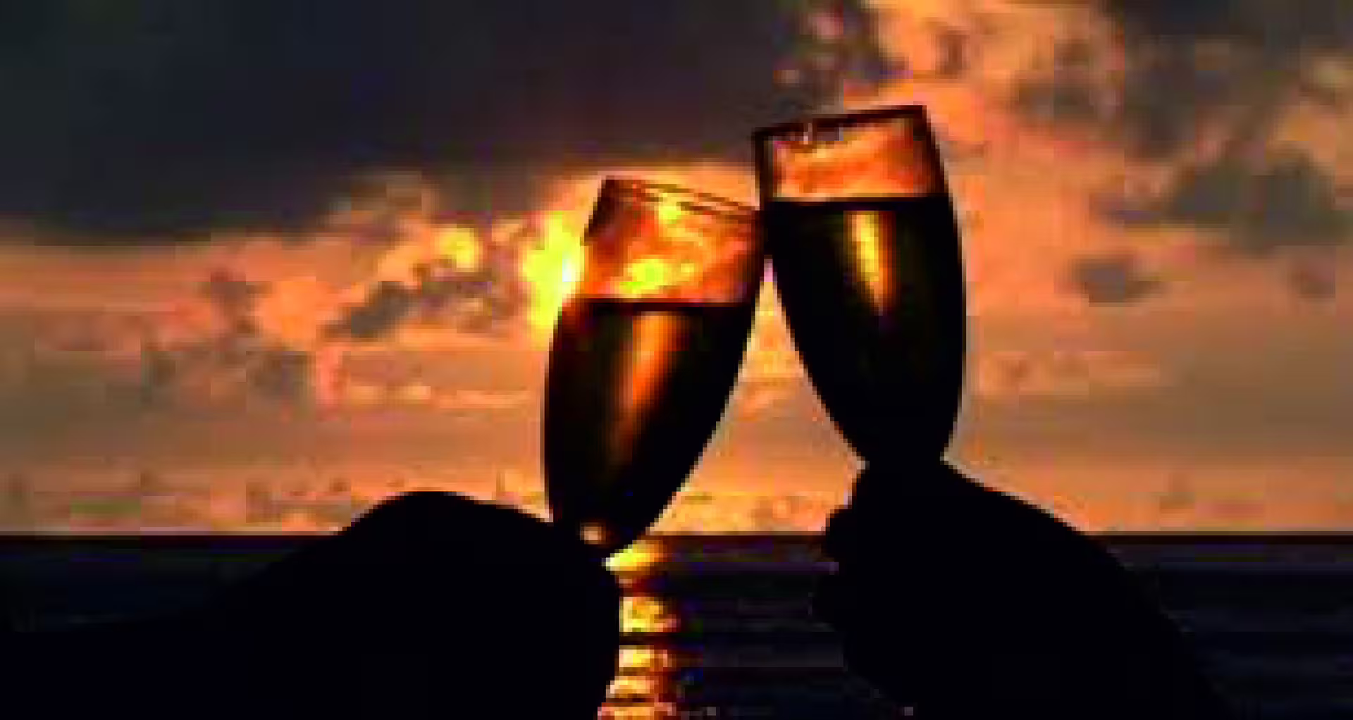 Champagne glasses clinking at golden hour on Lisbon sunset boat tour with wine on the Tagus River