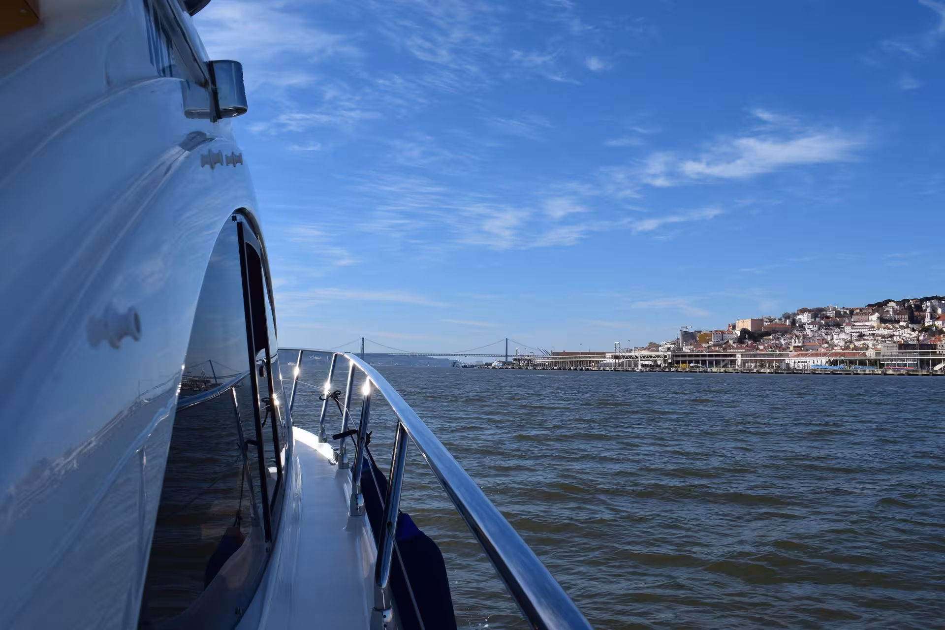 Cruising the Tagus River with Lisbon skyline and 25 de Abril Bridge, A Lisbon Tale by On Tales boat tour