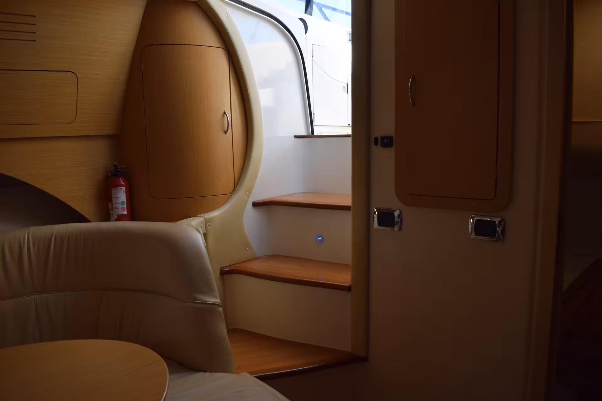 Cozy yacht cabin stairs and lounge seating for A Lisbon Tale by On Tales Lisbon private boat tour