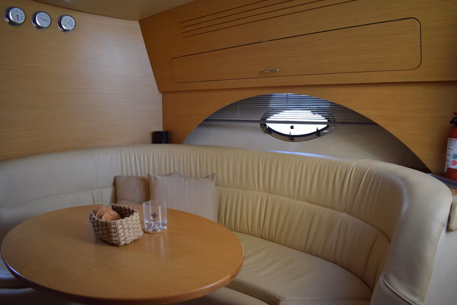Cozy yacht cabin seating and table setup for A Lisbon Tale by On Tales, private Lisbon Tagus River cruise