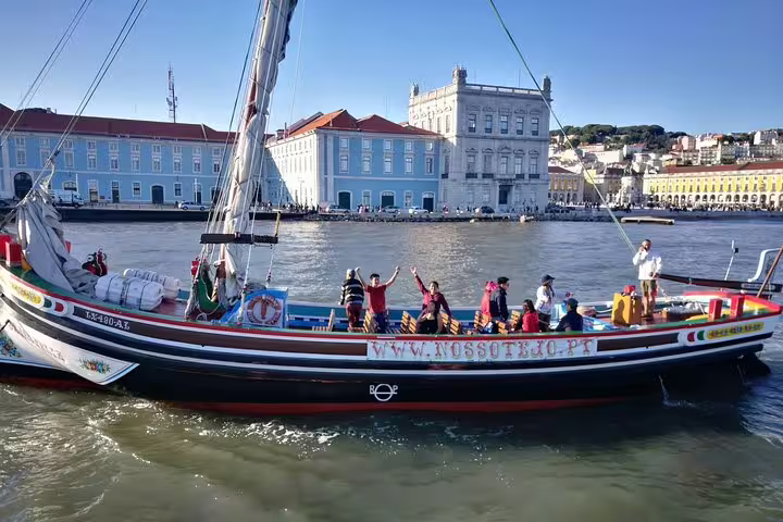 Sail past Lisbon's stunning architecture on a traditional boat, capturing the essence of a 45-minute express cruise.