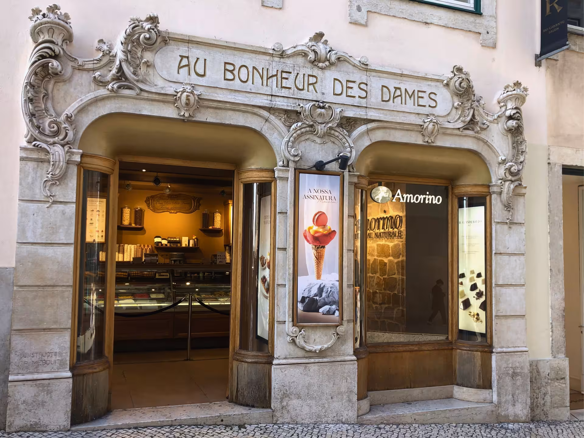 Au Bonheur des Dames vintage Lisbon storefront with ornate stonework, featured on Old Shops walking tour
